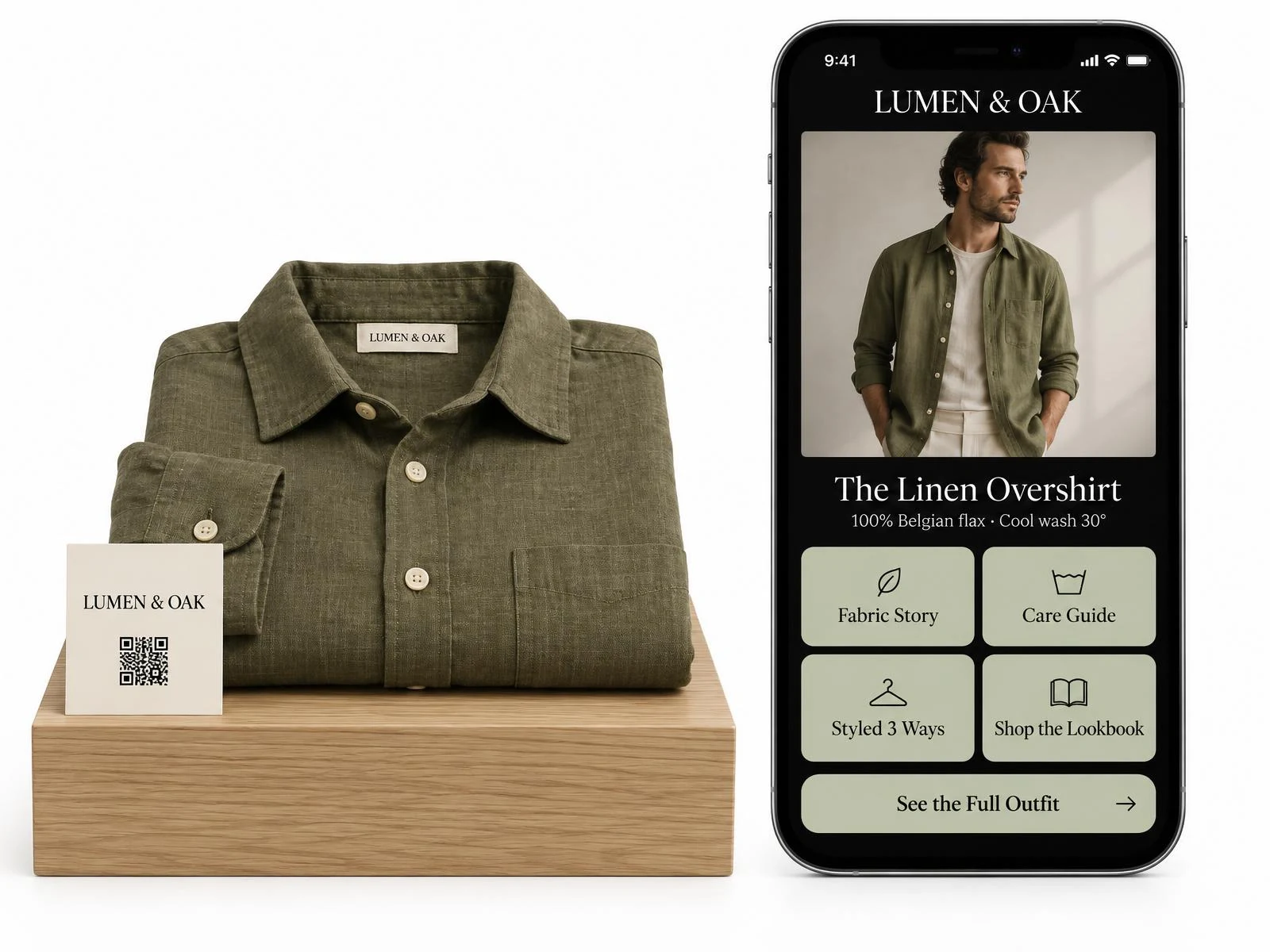 Folded olive Lumen & Oak linen shirt on an oak plinth with a small branded QR card beside a phone portal showing fabric story, care guide, styled three ways, shop the lookbook and see the full outfit